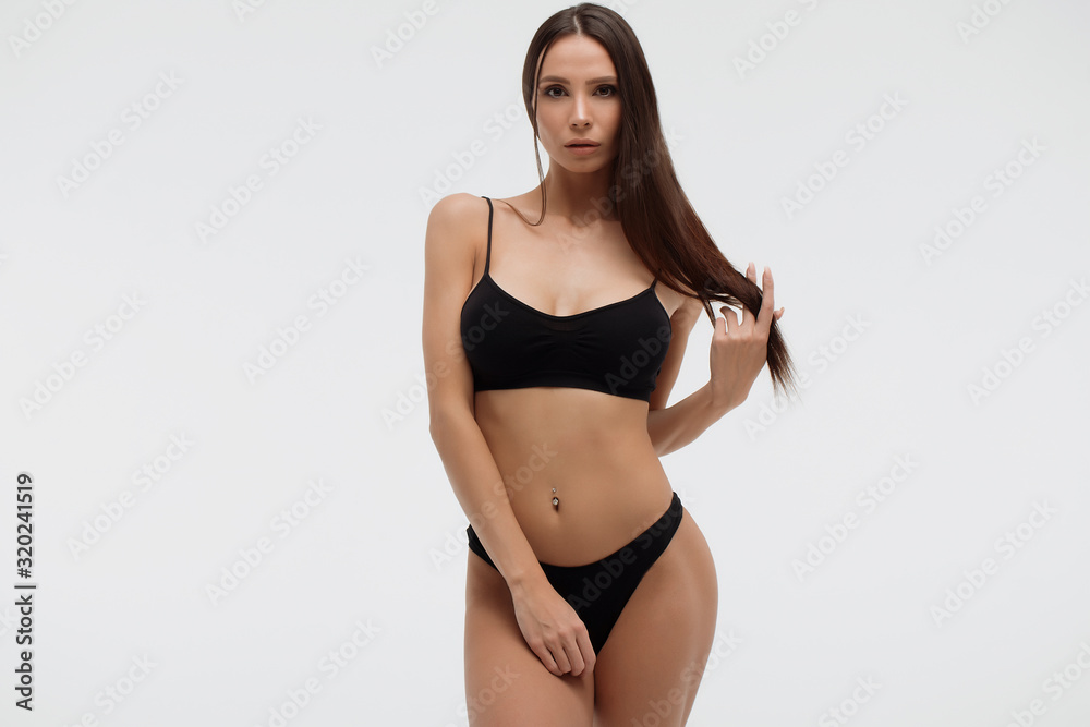 Sexy woman in underwear looking at camera sensually - obrazy, fototapety, plakaty 