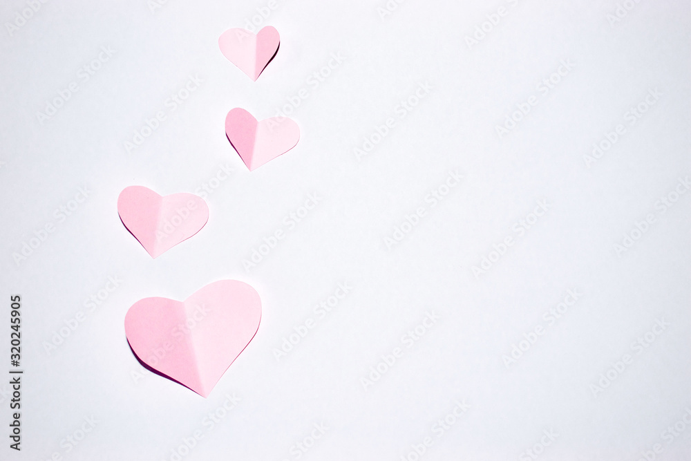 Valentines day background.Pink paper hearts with white background.