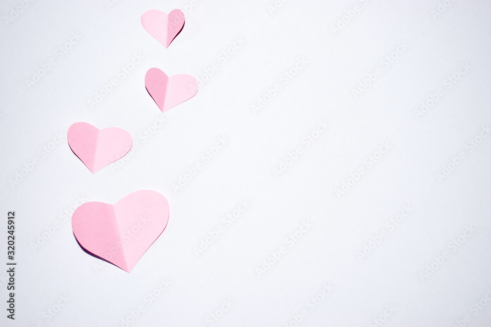 Valentines day background.Pink paper hearts with white background.