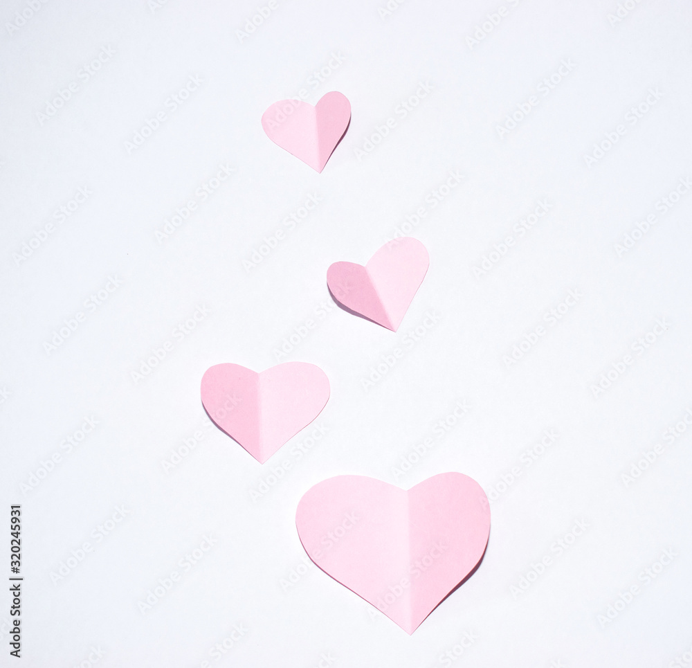 Valentines day background.Pink paper hearts with white background.