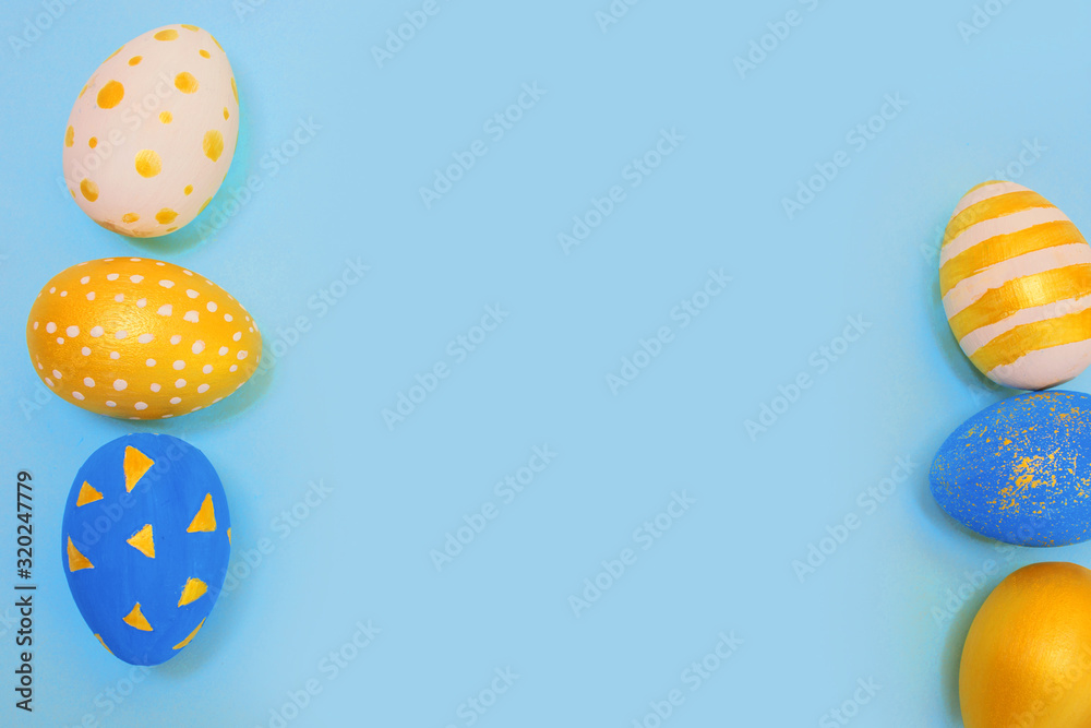 Easter golden and blue decorated eggs on blue Easter golden and blue decorated eggs on blue