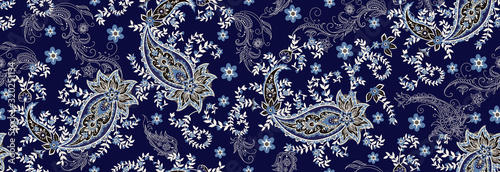 Seamless ethnic pattern of paisley and decorative floral branches. Indian motif. Vector background