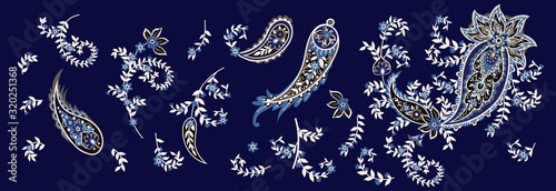 Set of paisley and blooming branches. Indian folk motif. Vector