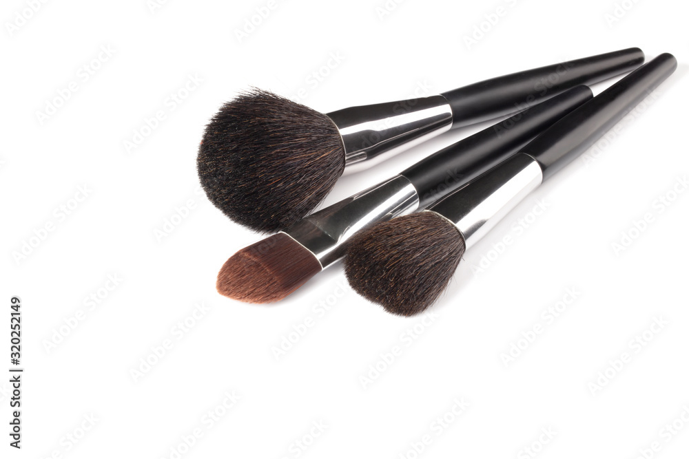 Cosmetic brushes for applying makeup. Makeup artist accessories isolated on white background. Accessories for the perfect make-up of the skin of the face.
