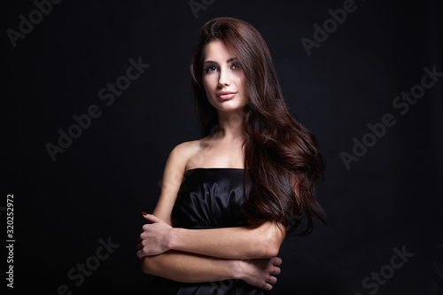 Beautiful Hair Girl in black dress. fashion beauty portrait