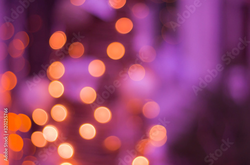 Abstract festive background with bokeh defocused lights.