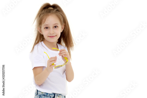 Little girl in sunglasses.Isolated on white background.