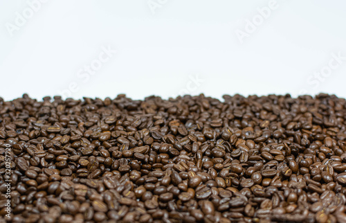 Coffee beans scattered on a white background horizontal photo