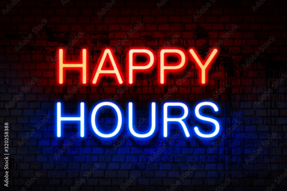 Happy hours. Neon sign with luminous letters of red and blue on black brick wall.