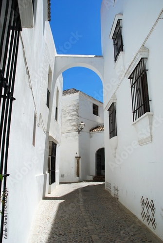 View along a whitewashed old town street, Arcos de la Frontera, Spain.