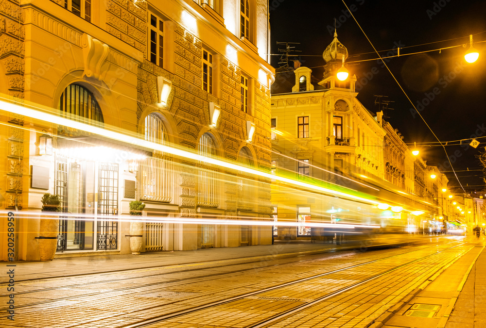 Fototapeta premium Croatia, city of Zagreb in the night, car and tram trails on the street, long exposure, city vibe