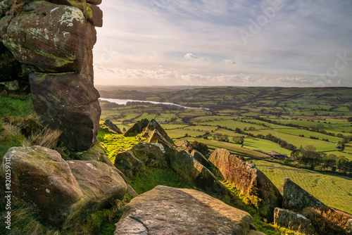 Epic Peak District Winter landscape of view from top of Hen Cloud over countryside and towards Tittesworth Reservoir photo