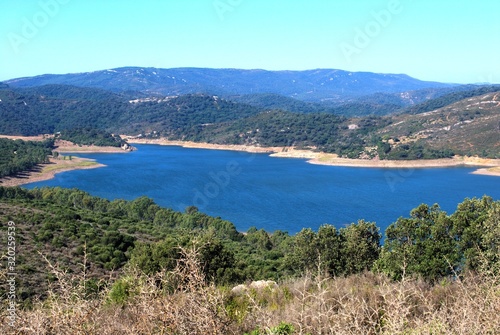 View across the lake and surrounding countryside (Embalse de Guadarranque), Castillo de Castellar, Spain.