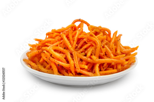 Plate with korean carrots on white.