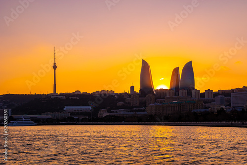 Night view of Baku with the Flame Towers skyscrapers photo