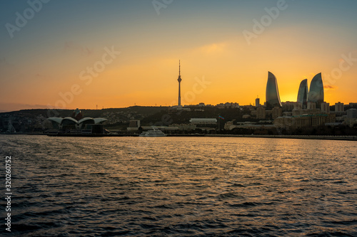 Night view of Baku with the Flame Towers skyscrapers photo