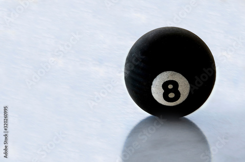 pool black ball number eight on ice surface