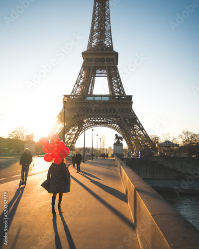 eiffel tower and girl with red balloon