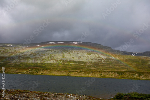 Mountain landscape with the shore of a mountain river in the Urals. Hiking in the north of Russia photo