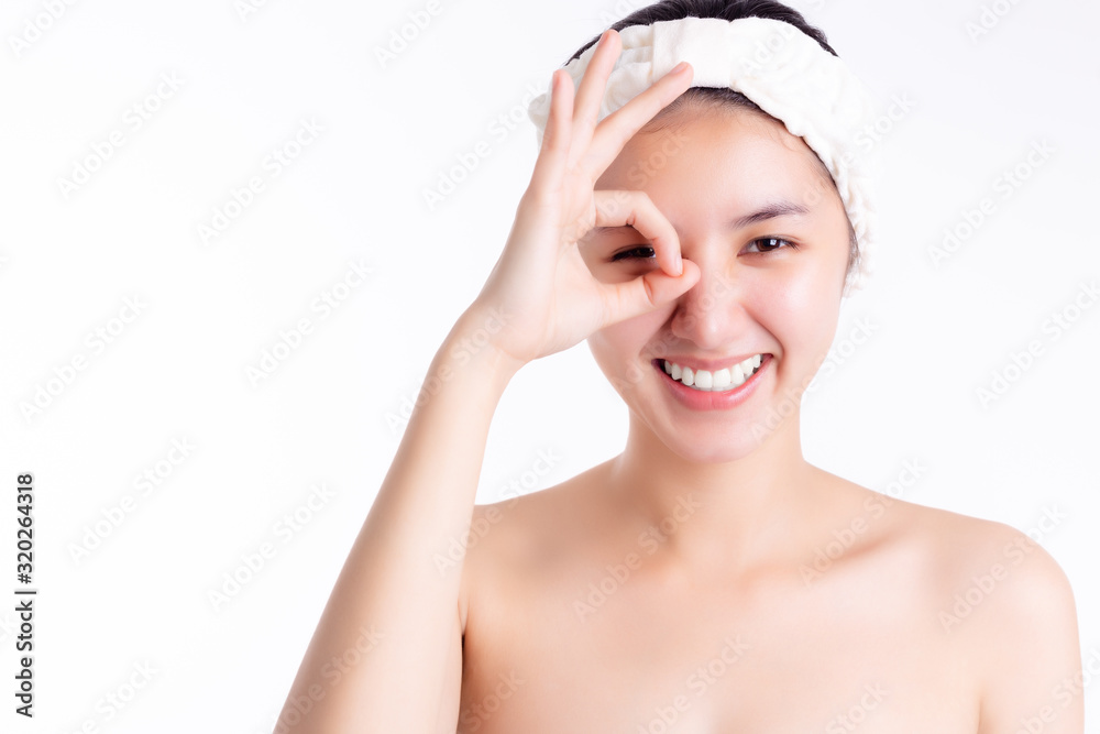 Skin care concept. Beauty Asian woman has beautiful face skin. Attractive beautiful female give okay, smile face. Pretty girl get happiness. Glamour woman has smooth skin face, radiant skin copy space Skin care concept. Beauty Asian woman has beautiful face skin. Attractive beautiful female give okay, smile face. Pretty girl get happiness. Glamour woman has smooth skin face, radiant skin copy space