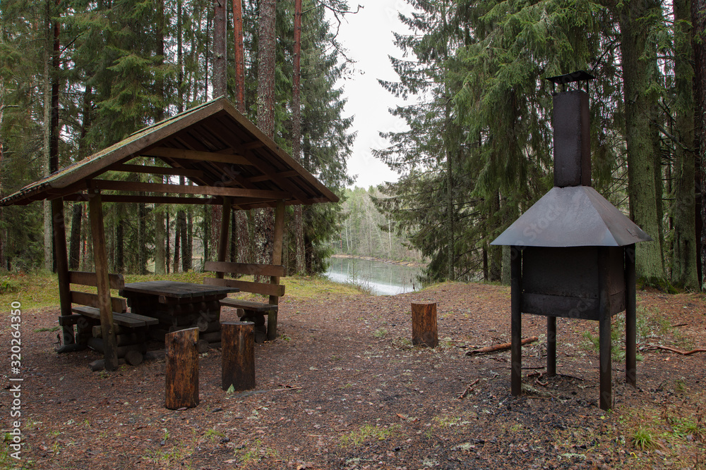 Rest area in the forest. Garden furniture and grill. Rest area in the forest. Garden furniture and grill.
