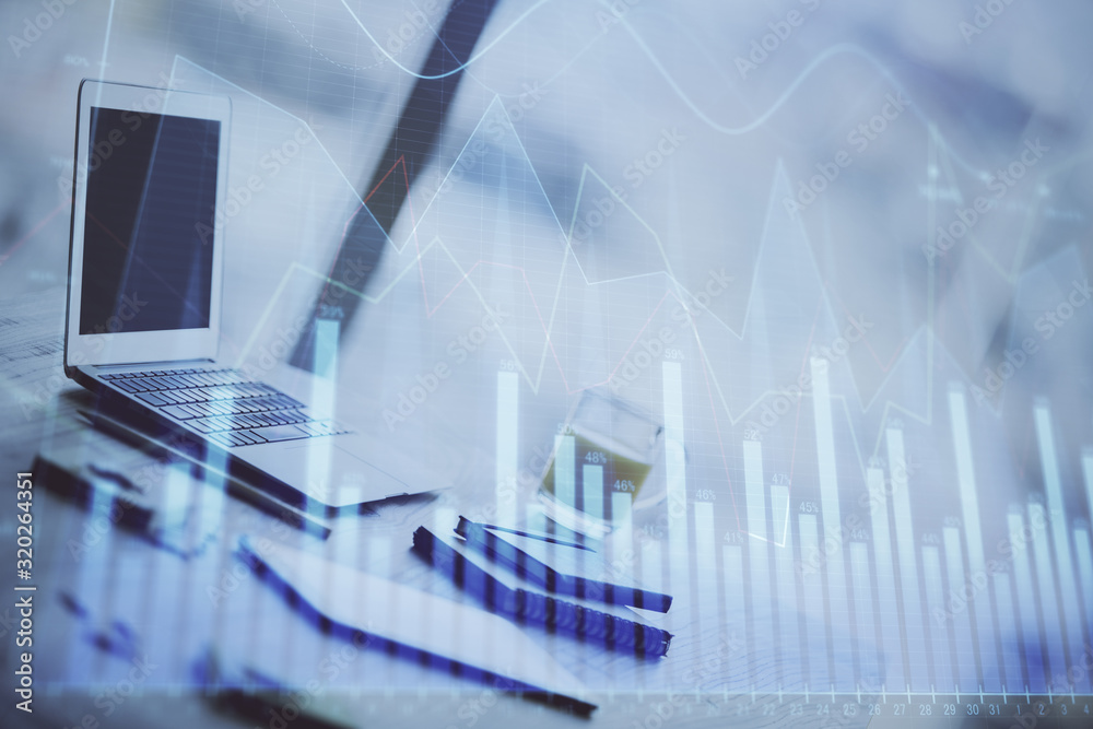 Forex graph hologram on table with computer background. Multi exposure. Concept of financial markets. Forex graph hologram on table with computer background. Multi exposure. Concept of financial markets.