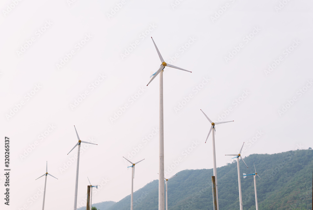 Low Angle View Of Wind Turbine Against Clear Sky Low Angle View Of Wind Turbine Against Clear Sky