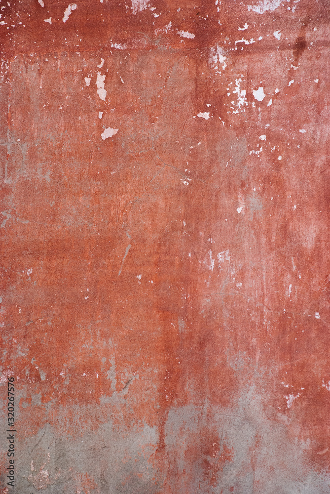 Old cemented shabby wall with white and red paint. Wallpaper of the old wall. Old cemented shabby wall with white and red paint. Wallpaper of the old wall.