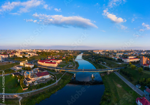 Panoramic view of the city of Grodno, the embankment, the Neman river and the old city. Autumn evening, the city in the sunshine against a background the blue sky.