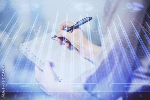 Wallpaper Mural Multi exposure of hands making notes with forex chart huds. Stock market concept. Torontodigital.ca