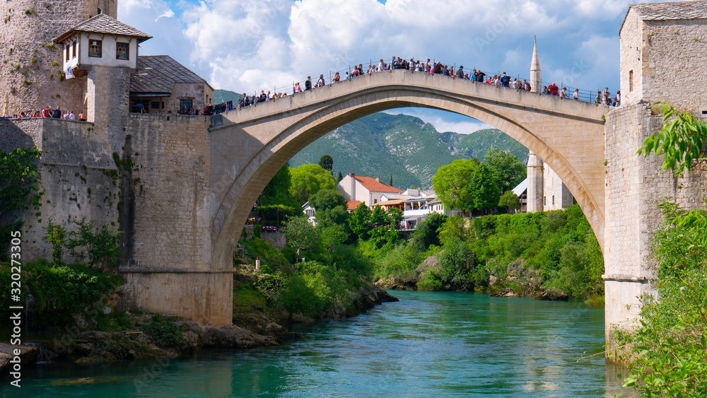 Mostar, Bosnia and Herzegovina, April 2019: Old town and Neretva River. The town was destroyed during the Croat-Bosniak war in 1993, reconstructed and now a UNESCO World Heritage Mostar, Bosnia and Herzegovina, April 2019: Old town and Neretva River. The town was destroyed during the Croat-Bosniak war in 1993, reconstructed and now a UNESCO World Heritage