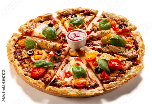 Sliced pizza with ham and artichoke on white background