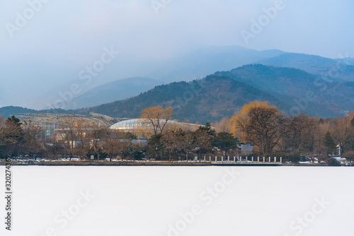 Wanshengyuan tropical greenhouse by Chengjing lake of Beijing Botanical Garden after snow in winter photo