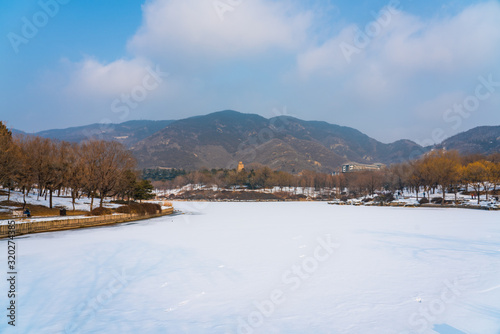 Chengjing lake of Beijing Botanical Garden after snow in winter. 