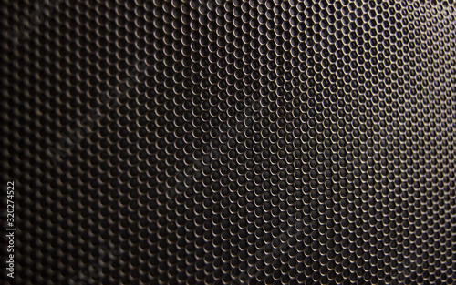 Metal perforated bronze background..