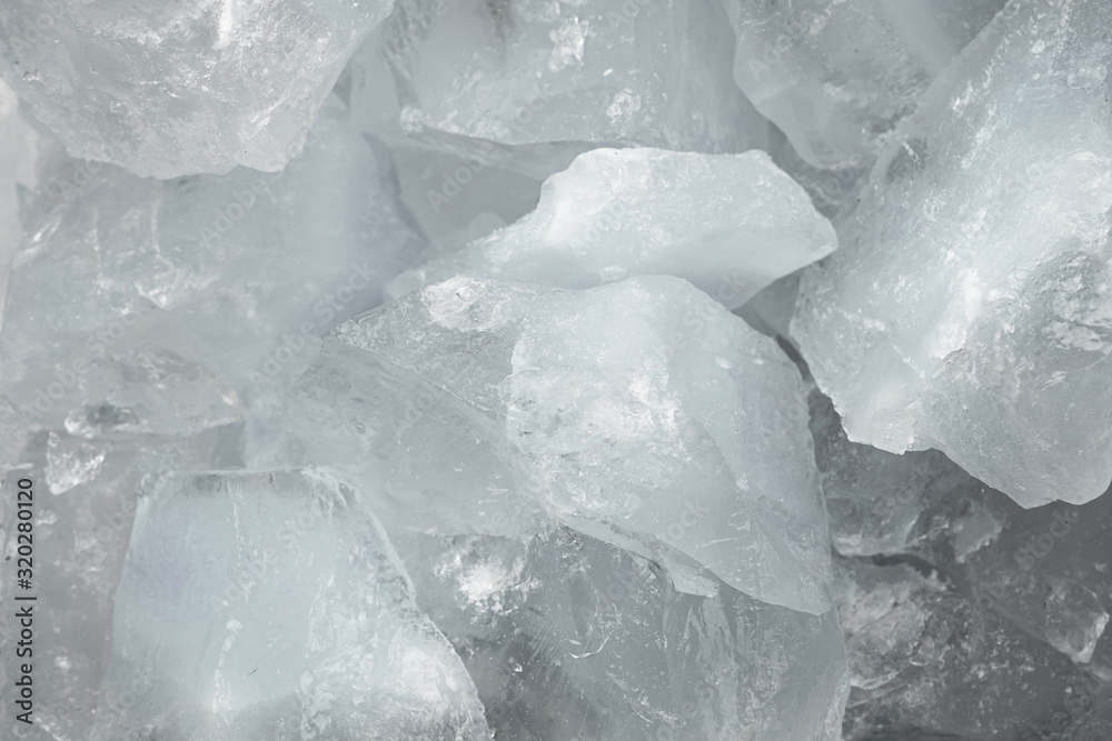 Pieces of crushed white ice glass cracks background texture. close-up frozen water