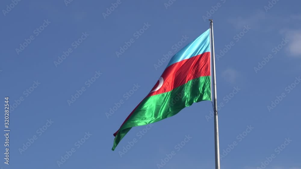 Azerbaijan national muslim flag Baku. National Azerbaijan flag waving against blue sky Azerbaijan national muslim flag Baku. National Azerbaijan flag waving against blue sky