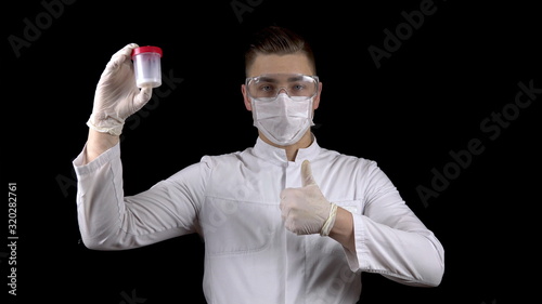Tableau sur toile Young man doctor checks sperm tests