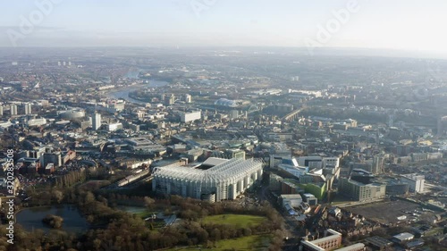 Newcastle upon Tyne aerial view, known as Newcastle, is a city in Tyne and Wear, North East England. Flying above the city ft. St James Park football stadium, park, river and central buildings in UK
