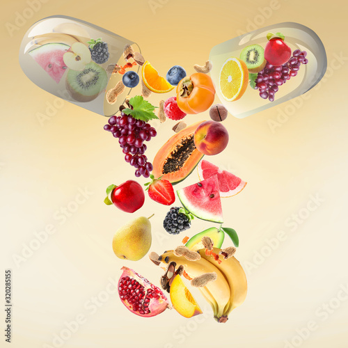 Fototapeta Naklejka Na Ścianę i Meble -  Capsule with falling fruits and nuts on color background