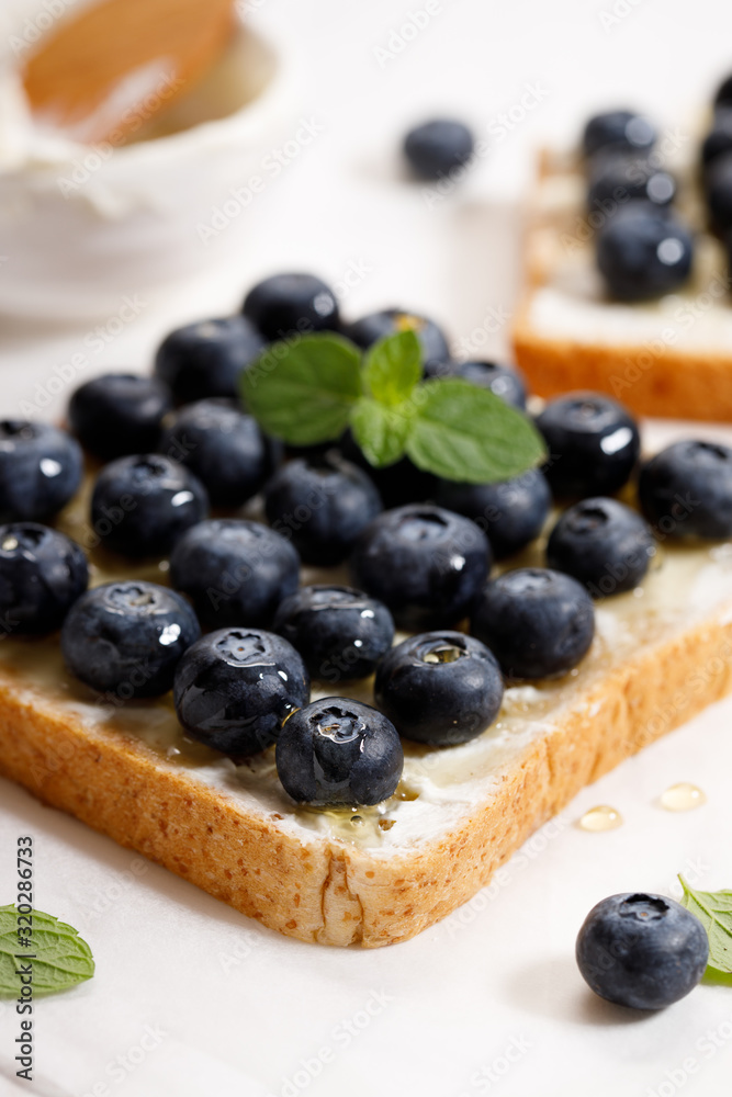Fototapeta premium blueberry toast with cream cheese and honey