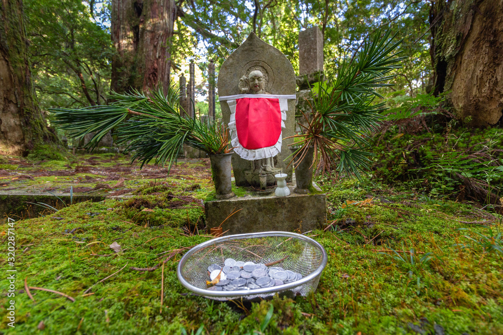 Fototapeta premium Jizo Statue in Ancient Graveyard of Okunoin Cemetery, Koyasan, Japan.