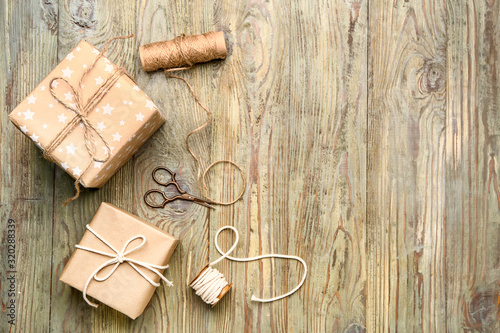Packed gifts on wooden  background