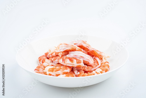 A plate of shrimp with open back and shrimp line