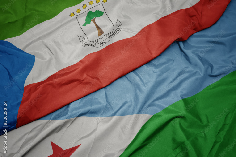 waving colorful flag of djibouti and national flag of equatorial guinea. waving colorful flag of djibouti and national flag of equatorial guinea.