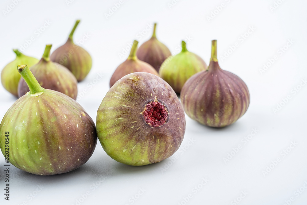 Bunch of fresh fruits figs on white background Bunch of fresh fruits figs on white background