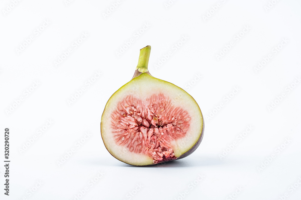 Fresh fruit fig slices on white background