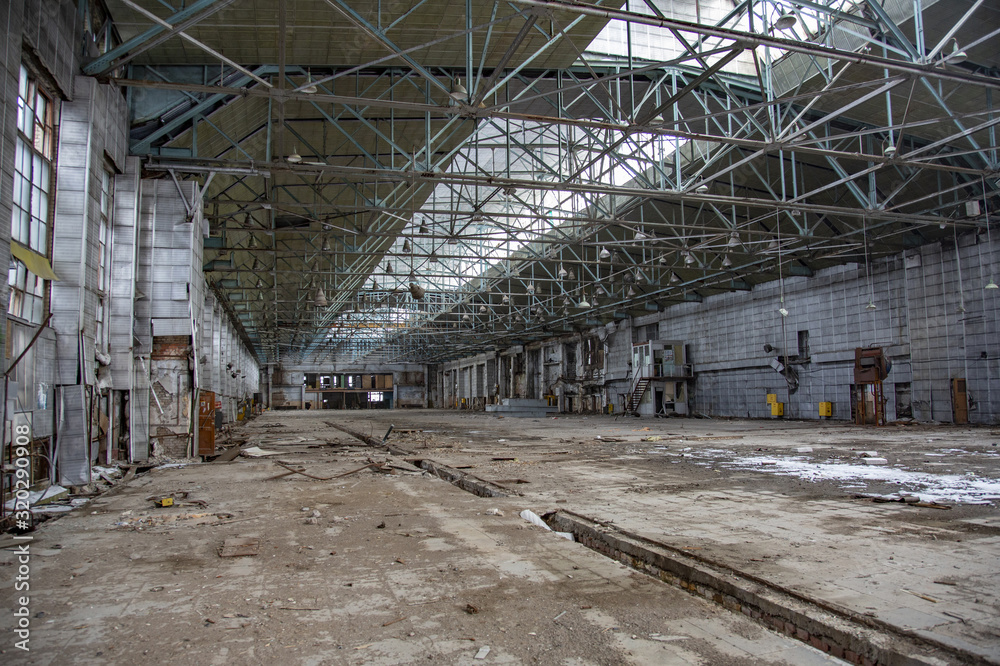 Interior of an abandoned industrial workshop. MIG Aircraft Building Plant in Moscow, Russia Interior of an abandoned industrial workshop. MIG Aircraft Building Plant in Moscow, Russia
