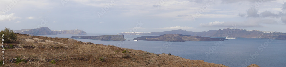 Panoramic views of the caldera, mountains, the Mediterranean Sea, and the city of Fira from the Akrotiri Lighthouse.