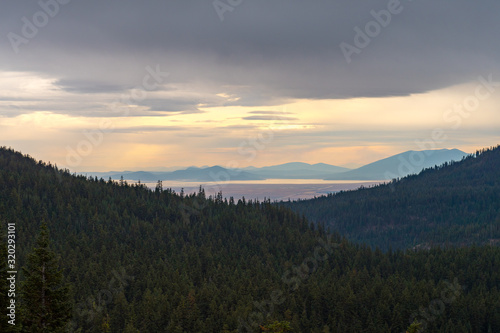 Forests, lake and storm clouds seen from Crater Lake